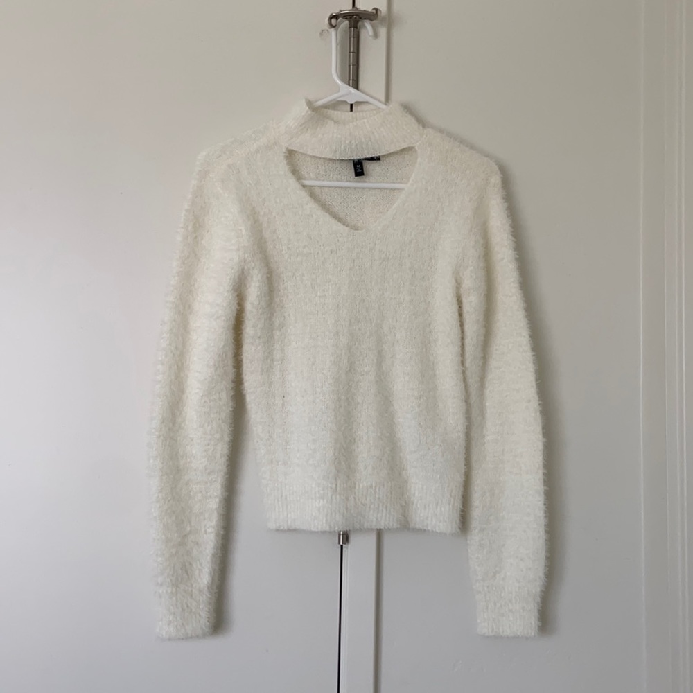 Shaggy white sweater with cutout